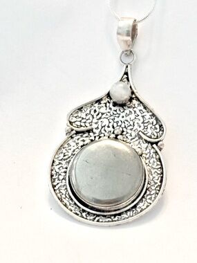 2 1/2 in, ,925 marked, Pyrite Agate and Rainbow Moonstone, on a silver chain.